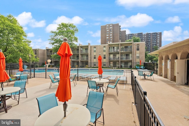 7 Canterbury Sq Unit 401, Alexandria, VA 22304 - community pool featuring fence, a patio, and outdoor dining space