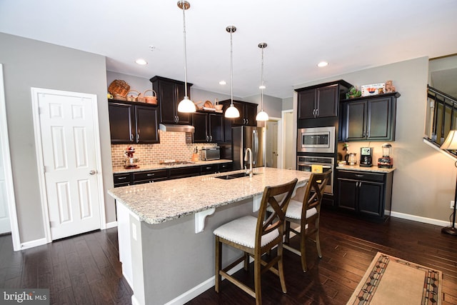 130 Steamboat Ct, North East, MD 21901 - kitchen with stainless steel appliances, a sink, tasteful backsplash, dark wood finished floors, and recessed lighting