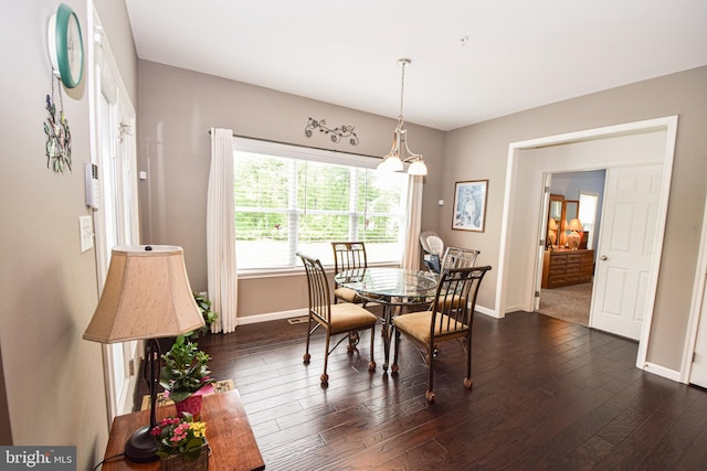 130 Steamboat Ct, North East, MD 21901 - dining area with baseboards, dark wood-style flooring, and a chandelier