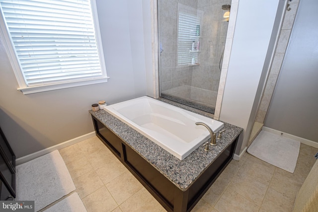 130 Steamboat Ct, North East, MD 21901 - full bathroom featuring a garden tub, a tile shower, baseboards, and tile patterned flooring