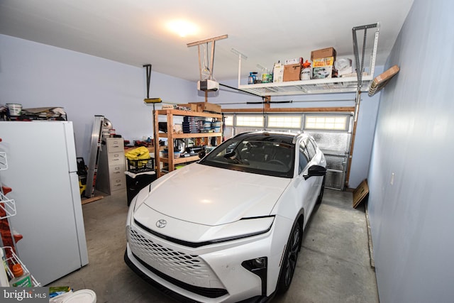 130 Steamboat Ct, North East, MD 21901 - garage with freestanding refrigerator and a garage door opener