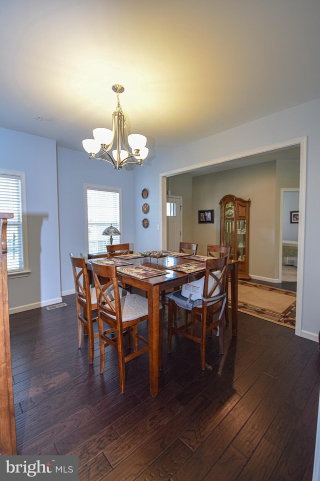 130 Steamboat Ct, North East, MD 21901 - dining room featuring a chandelier, dark wood-type flooring, and baseboards