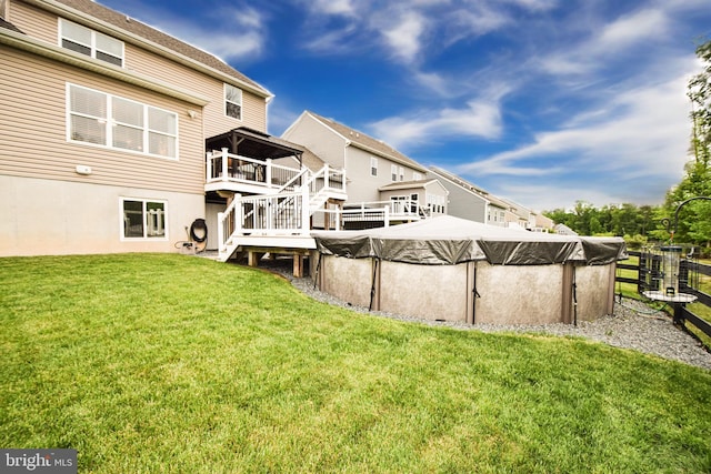 130 Steamboat Ct, North East, MD 21901 - view of green lawn featuring a wooden deck, stairway, and a covered pool