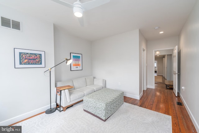 living room with wood finished floors, ceiling fan, baseboards, and recessed lighting