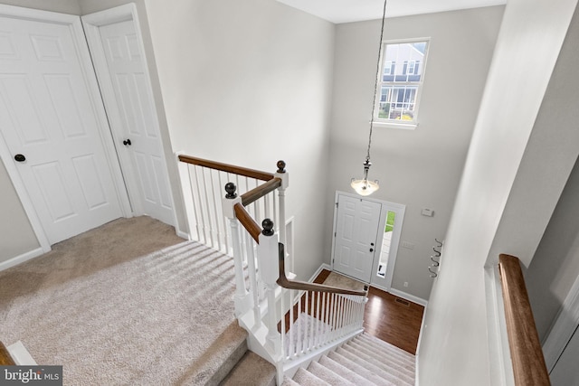 entryway with baseboards and wood finished floors