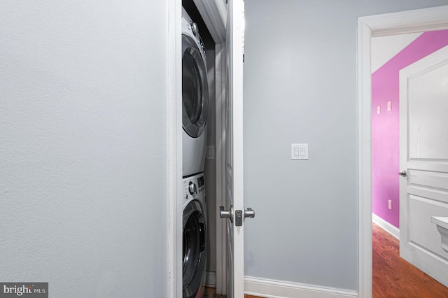 1248 N Hollywood St, Philadelphia, PA 19121 - laundry area with stacked washer / dryer, baseboards, and dark wood finished floors