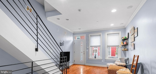1248 N Hollywood St, Philadelphia, PA 19121 - foyer with wood finished floors, ornamental molding, recessed lighting, stairway, and baseboards