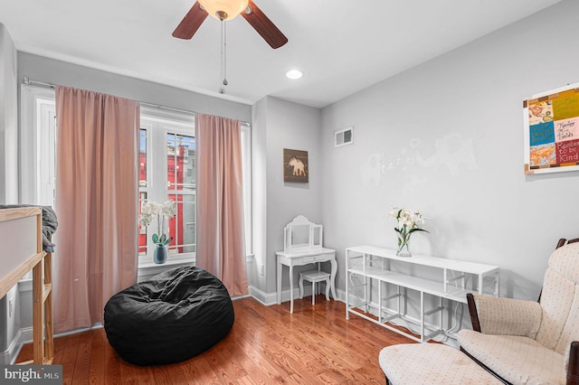 1248 N Hollywood St, Philadelphia, PA 19121 - sitting room with a ceiling fan, wood finished floors, baseboards, and recessed lighting