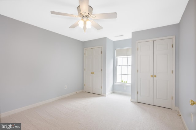 615 Pearl Point Ct, Millersville, MD 21108 - unfurnished bedroom with carpet flooring, multiple closets, baseboards, and ceiling fan