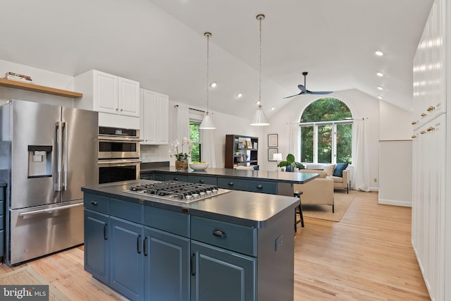 4009 30th St N, Arlington, VA 22207 - kitchen with appliances with stainless steel finishes, dark countertops, a kitchen island, plenty of natural light, and recessed lighting