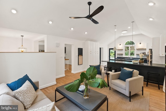4009 30th St N, Arlington, VA 22207 - living area featuring ceiling fan, vaulted ceiling, light wood-style floors, recessed lighting, and baseboards