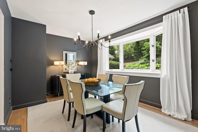 4009 30th St N, Arlington, VA 22207 - dining space featuring a chandelier, wood finished floors, and baseboards
