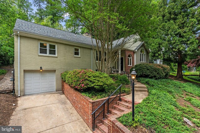 4009 30th St N, Arlington, VA 22207 - single story home featuring a garage, brick siding, driveway, and roof with shingles