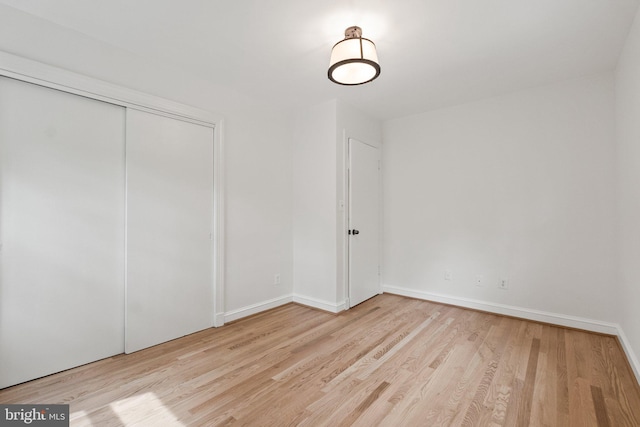 4009 30th St N, Arlington, VA 22207 - unfurnished bedroom with wood finished floors, baseboards, and a closet