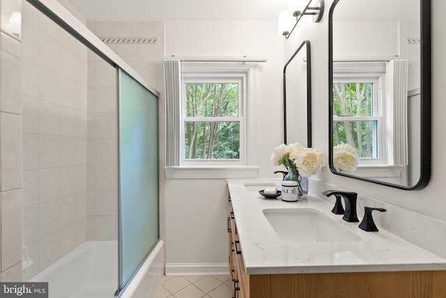 4009 30th St N, Arlington, VA 22207 - full bath featuring tile patterned floors, shower / bath combination with glass door, double vanity, and baseboards