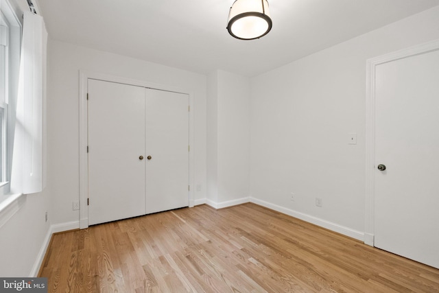 4009 30th St N, Arlington, VA 22207 - unfurnished bedroom with light wood-type flooring, baseboards, and a closet
