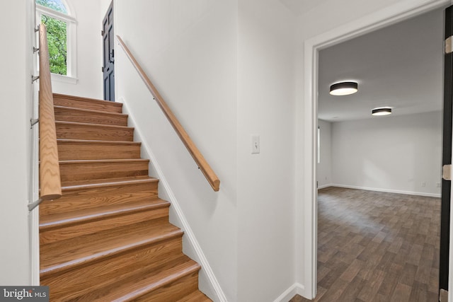 4009 30th St N, Arlington, VA 22207 - staircase featuring wood finished floors and baseboards