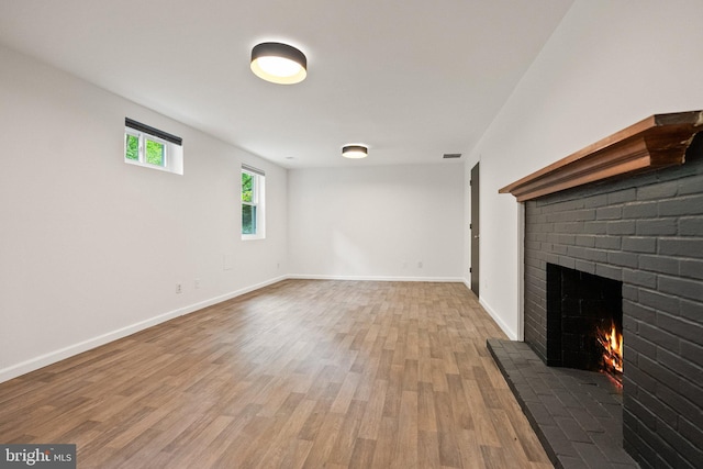 4009 30th St N, Arlington, VA 22207 - unfurnished living room featuring a fireplace, wood finished floors, and baseboards