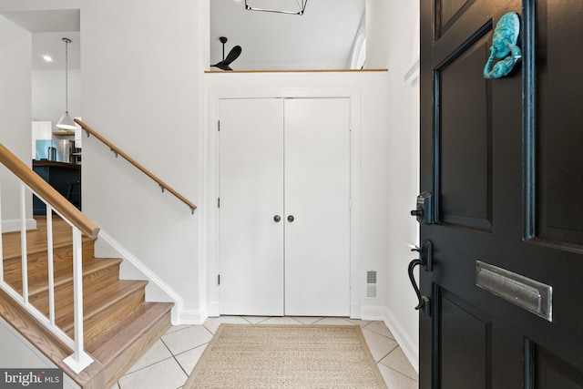 4009 30th St N, Arlington, VA 22207 - entrance foyer with light tile patterned floors, stairway, and baseboards