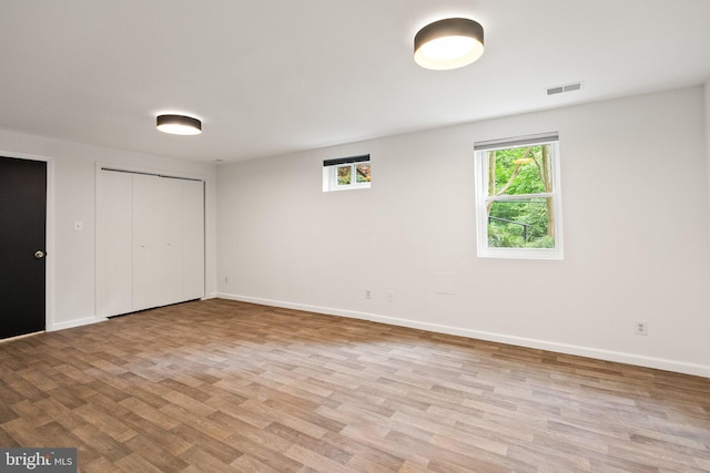 4009 30th St N, Arlington, VA 22207 - unfurnished bedroom featuring wood finished floors, baseboards, and a closet