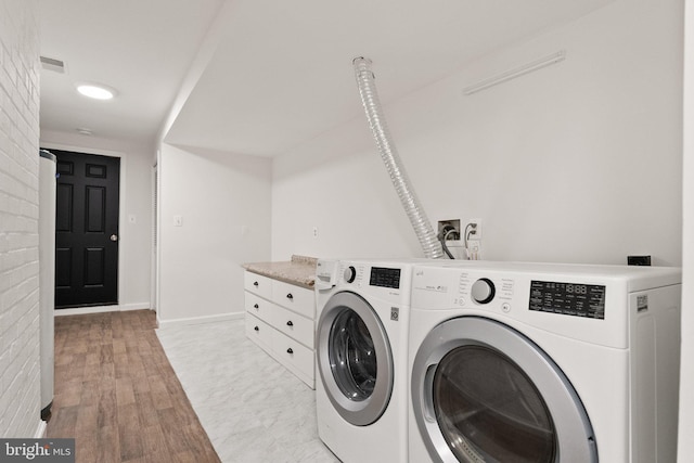 4009 30th St N, Arlington, VA 22207 - washroom featuring washer and clothes dryer, light wood finished floors, and baseboards