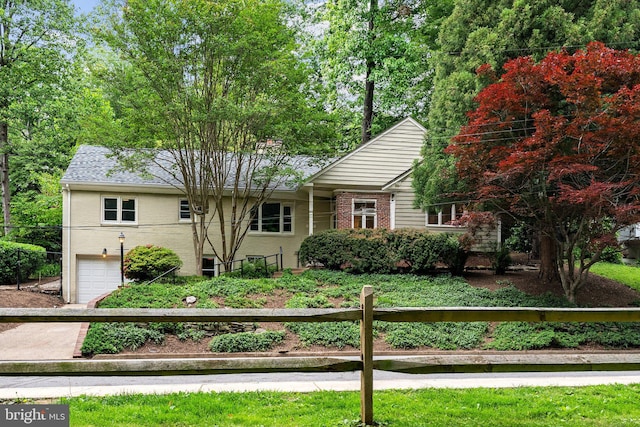 4009 30th St N, Arlington, VA 22207 - view of front facade with an attached garage and brick siding