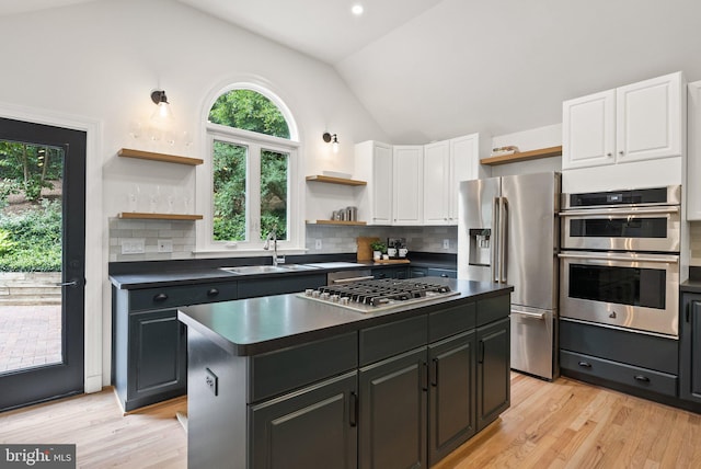 4009 30th St N, Arlington, VA 22207 - kitchen with open shelves, appliances with stainless steel finishes, a sink, vaulted ceiling, and dark countertops