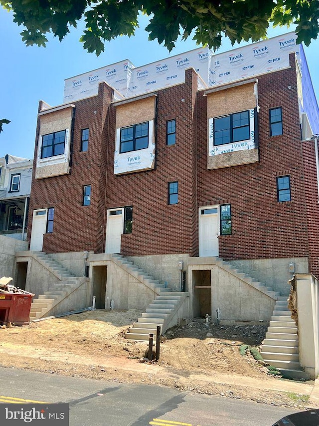 view of building exterior with stairs