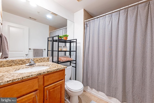 bathroom featuring toilet, tile patterned flooring, vanity, and curtained shower