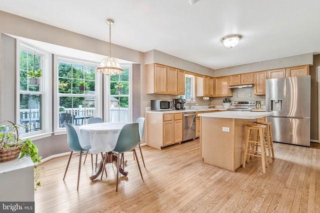2452 Tuckahoe Ct, Waldorf, MD 20601 - kitchen with stainless steel appliances, light brown cabinets, light countertops, and light wood-style flooring