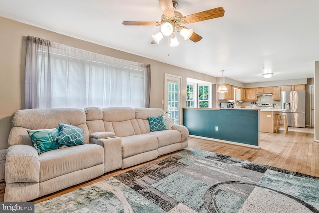 2452 Tuckahoe Ct, Waldorf, MD 20601 - living area with light wood finished floors and ceiling fan
