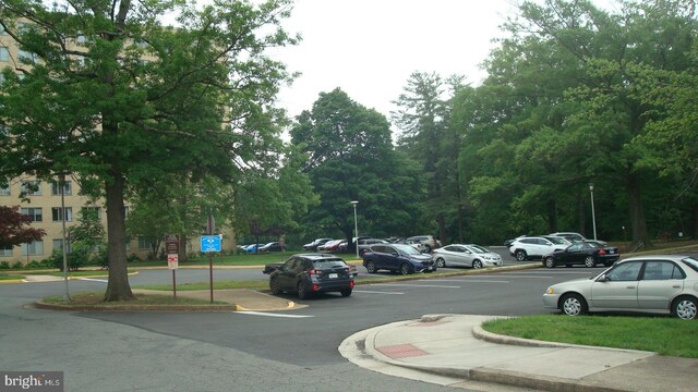6641 Wakefield Dr Unit 801, Alexandria, VA 22307 - view of asphalt street featuring curbs, street lighting, and traffic signs