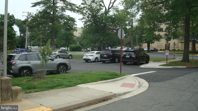 6641 Wakefield Dr Unit 801, Alexandria, VA 22307 - view of asphalt road featuring traffic signs, curbs, and sidewalks