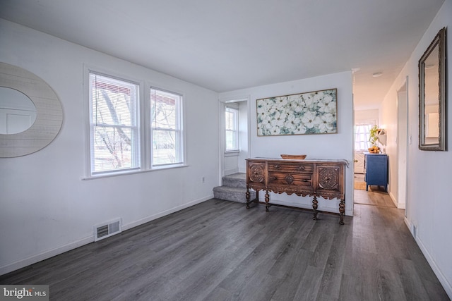 bedroom featuring dark wood-type flooring and baseboards