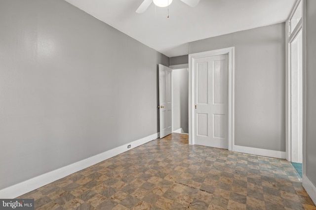 848 Houston St, Columbia, PA 17512 - unfurnished bedroom with stone finish floors, baseboards, and a ceiling fan