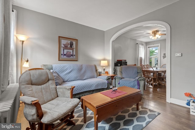848 Houston St, Columbia, PA 17512 - living area with wood finished floors, arched walkways, baseboards, and ceiling fan