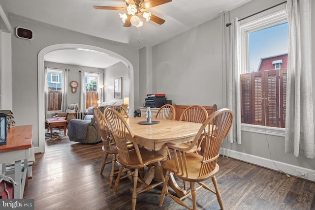 848 Houston St, Columbia, PA 17512 - dining room featuring arched walkways, ceiling fan, and dark wood-style floors