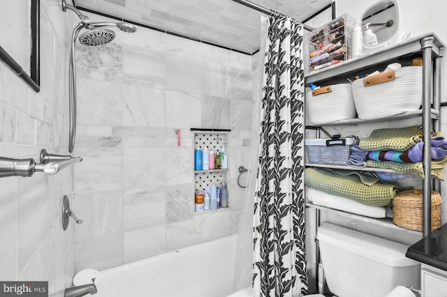full bath featuring shower / tub combo with curtain and toilet