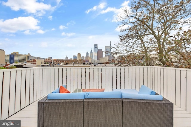 view of patio / terrace with a view of skyline and an outdoor living space