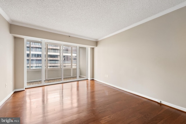 1300 Crystal Dr Unit 1408S, Arlington, VA 22202 - unfurnished room with a textured ceiling, ornamental molding, wood finished floors, and baseboards