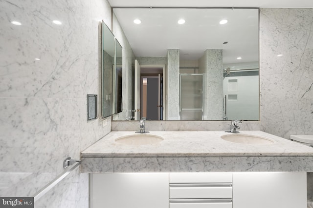 1300 Crystal Dr Unit 1408S, Arlington, VA 22202 - bathroom with double vanity, tile walls, a shower stall, recessed lighting, and toilet