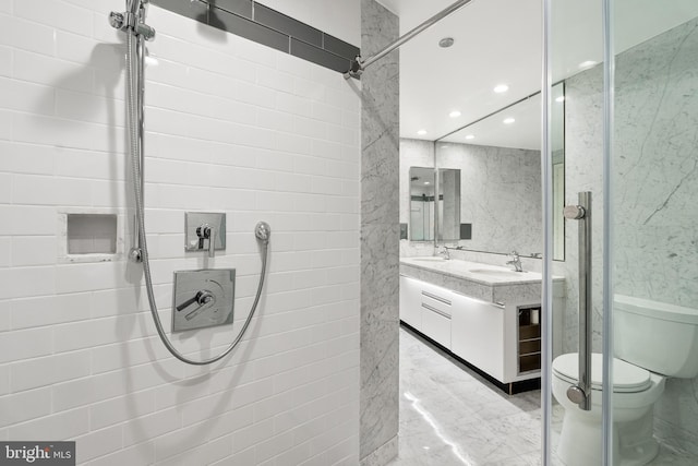 1300 Crystal Dr Unit 1408S, Arlington, VA 22202 - full bath featuring toilet, recessed lighting, double vanity, a shower, and tile walls