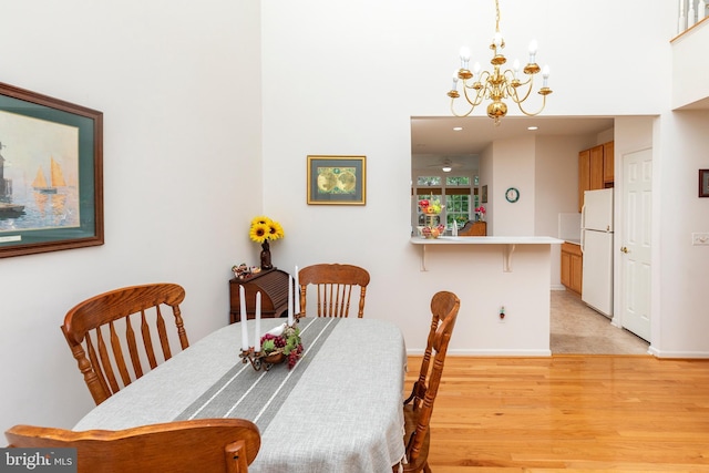 31142 Mills Chase Dr Unit 9, Lewes, DE 19958 - dining room featuring a chandelier, light wood-type flooring, baseboards, and recessed lighting