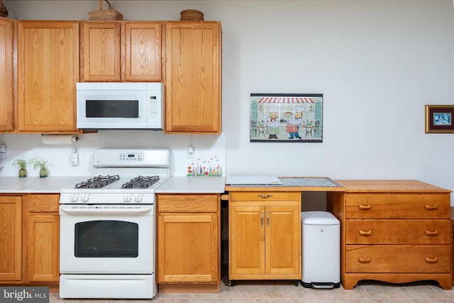 31142 Mills Chase Dr Unit 9, Lewes, DE 19958 - kitchen with white appliances and light countertops