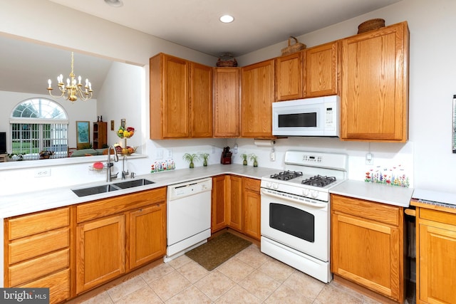 31142 Mills Chase Dr Unit 9, Lewes, DE 19958 - kitchen featuring white appliances, a sink, light countertops, a chandelier, and light tile patterned floors