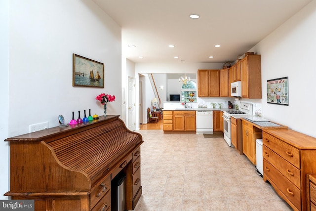 31142 Mills Chase Dr Unit 9, Lewes, DE 19958 - kitchen featuring white appliances, recessed lighting, light countertops, a sink, and brown cabinetry