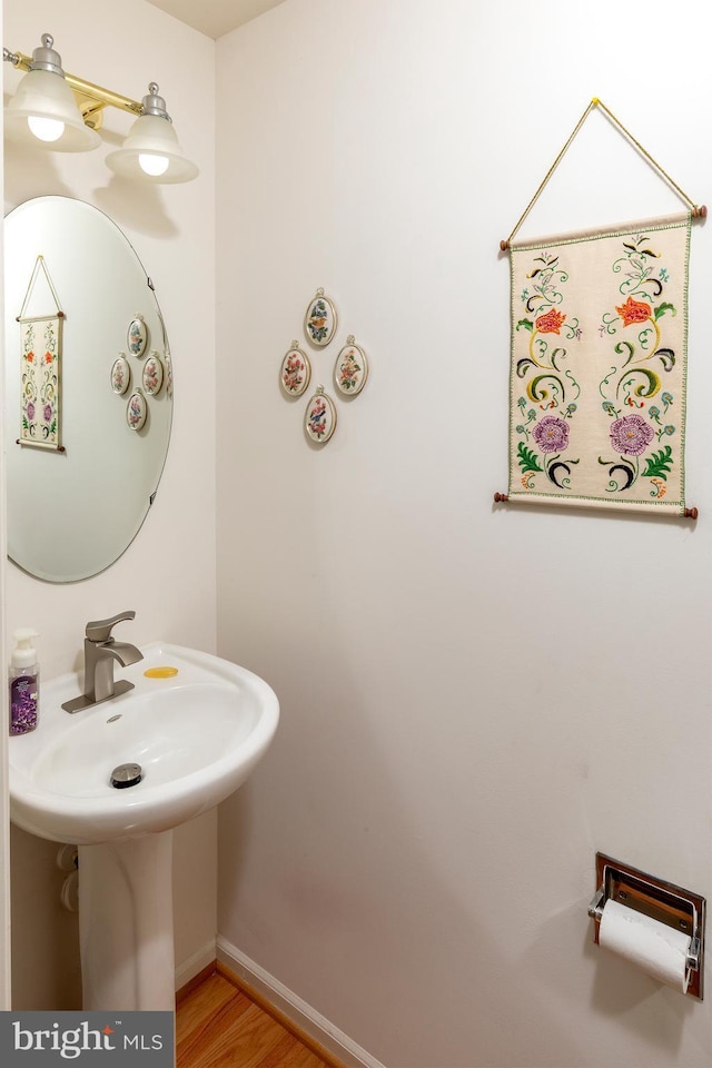 31142 Mills Chase Dr Unit 9, Lewes, DE 19958 - bathroom with wood finished floors and baseboards