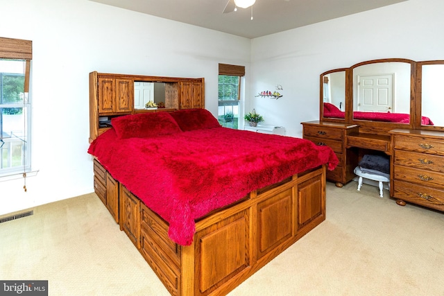 31142 Mills Chase Dr Unit 9, Lewes, DE 19958 - bedroom with light colored carpet and ceiling fan