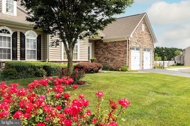 31142 Mills Chase Dr Unit 9, Lewes, DE 19958 - view of front of property featuring a shingled roof, asphalt driveway, a front lawn, and an attached garage