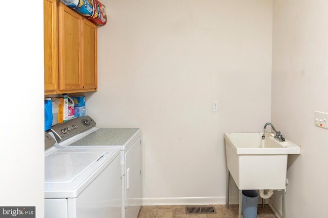 31142 Mills Chase Dr Unit 9, Lewes, DE 19958 - laundry room with washing machine and clothes dryer, cabinet space, and baseboards